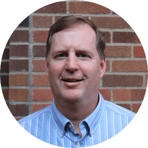 profile photo of professor Mike Kilgore, a white man clean shaven in a striped collared shirt